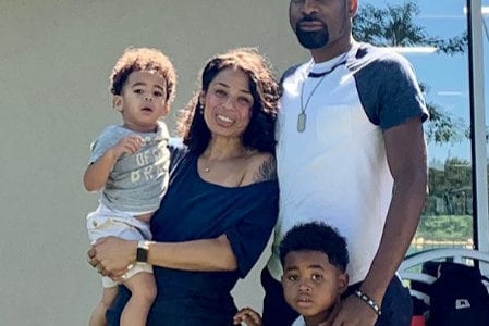 A family photo in front of a building.