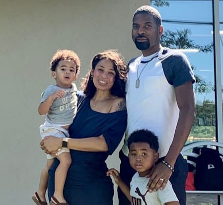 A family photo in front of a building.