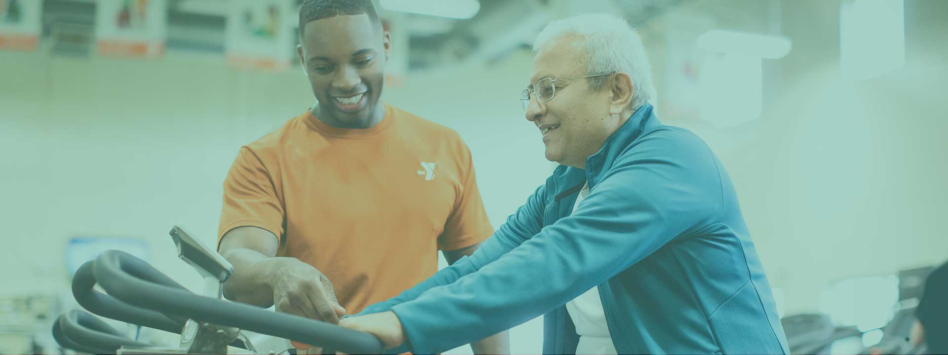 personal trainer and trainee at gym