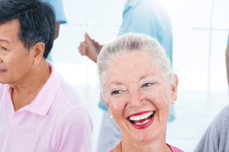 Group of smiling seniors socializing together