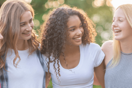 Group of smiling young women outdoors