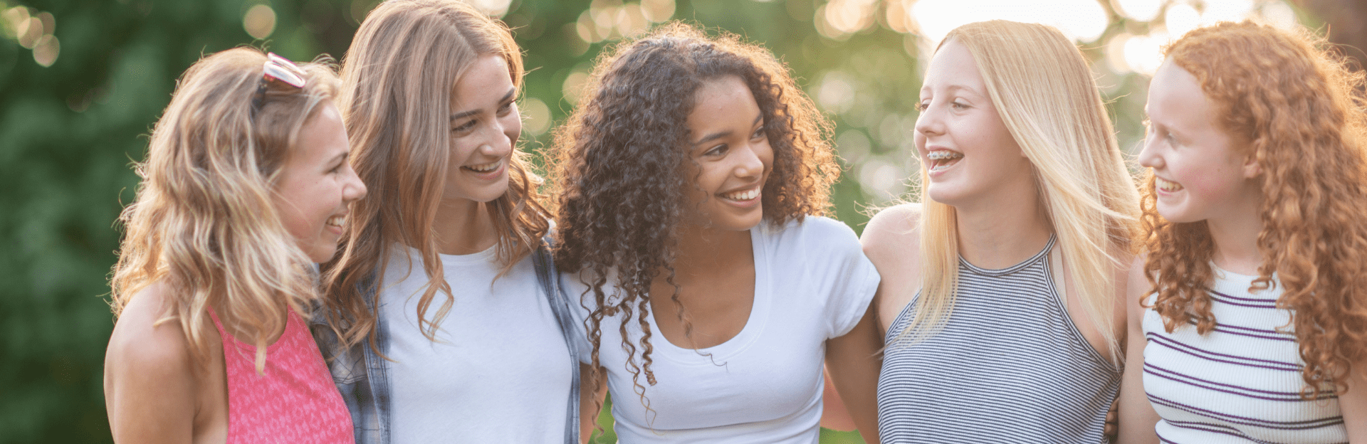Group of smiling young women outdoors