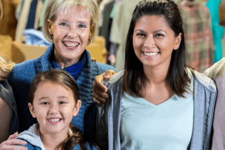 People posing for photo at store.