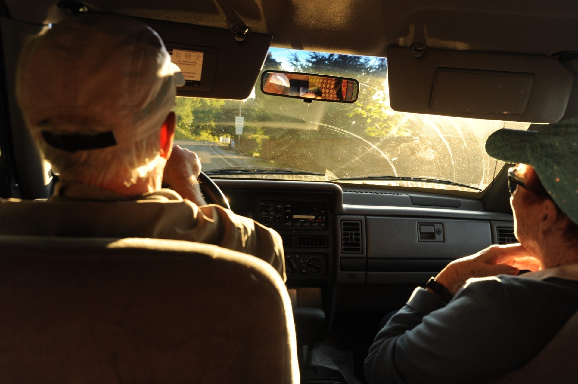 This is an image of two men in a car.