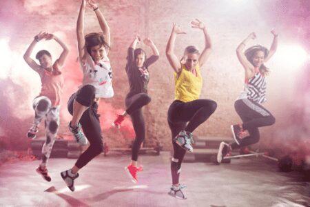 Group of women dancing energetically